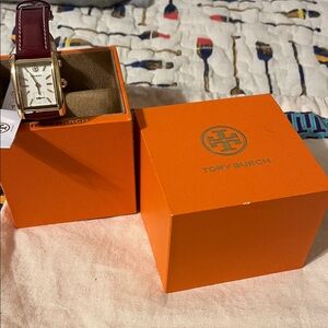 Tory Burch Burgundy and Gold Women’s. New with tags  and box. Never worn.